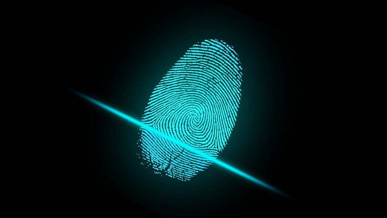 blue fingerprint scanned on black background