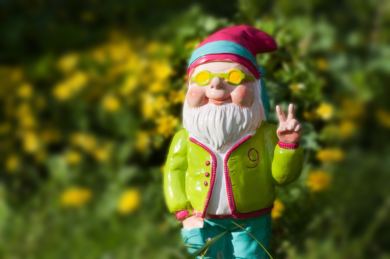 garden gnome in back yard giving peace sign