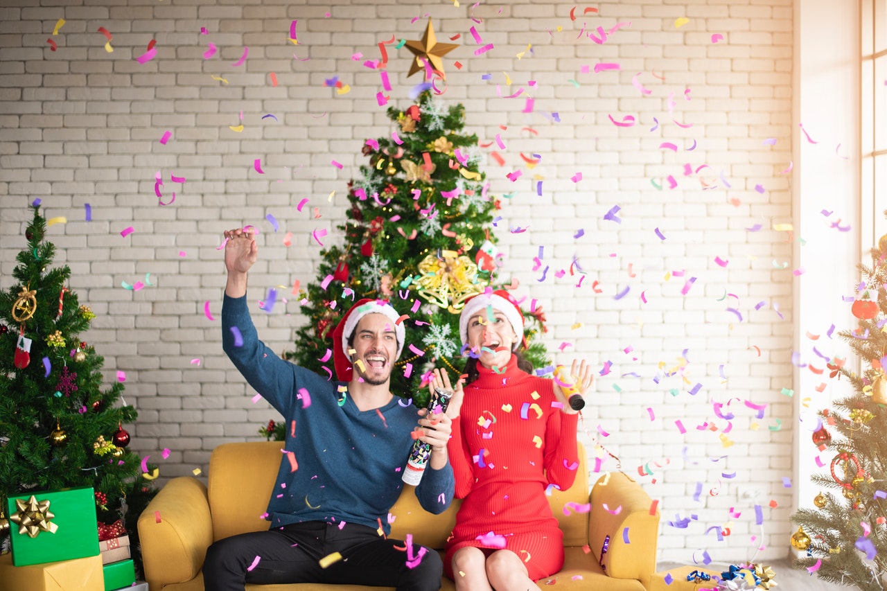 man and woman holiday celebration confetti